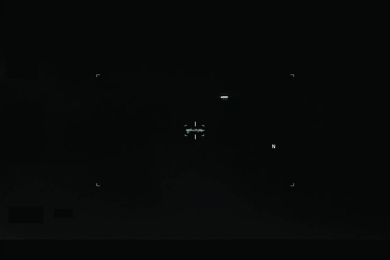 FLIR capture of small elongated object against pure black night sky, Army 2026